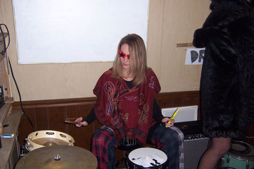 Girl Plays Drums at the Dry Campus Xmas Party by Zach Surp